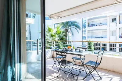 a balcony with a table and chairs at Résidence 2p Avec Piscine Au Palm Beach - 2P avec piscine au Palm Beach MAE-2313 in Cannes