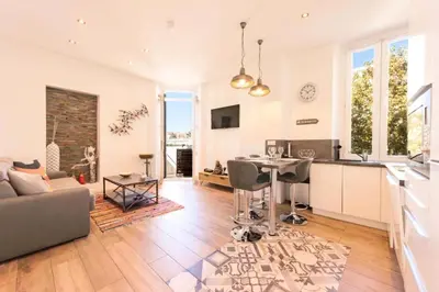a kitchen and living room with a couch and a table at Résidence Hyper Centre, Croisette, Plages Et Palais à Pied - Hyper centre, Croisette, plages et Palais à pied MAE-2333 in Cannes