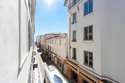 a view of a street between two buildings at Résidence Hyper Centre, Croisette, Plages Et Palais à Pied - Hyper centre, Croisette, plages et Palais à pied MAE-2333 in Cannes