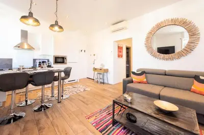 a living room with a couch and a table at Résidence Hyper Centre, Croisette, Plages Et Palais à Pied - Hyper centre, Croisette, plages et Palais à pied MAE-2333 in Cannes