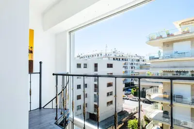 a balcony with a view of a building at Résidence Duplex En Toit-terrasse à Deux Pas De La Croisette - Duplex en toit-terrasse à deux pas de la Croisette MAE-2383 in Cannes