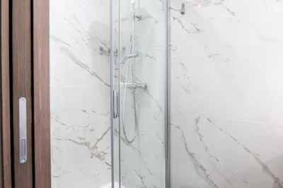 a shower with a glass door in a bathroom at Résidence Rare ! Rez-de-jardin 10 Minutes à Pied Du Centre - RARE ! Rez-de-jardin 10 minutes à pied du centre MAE-2413 in Cannes