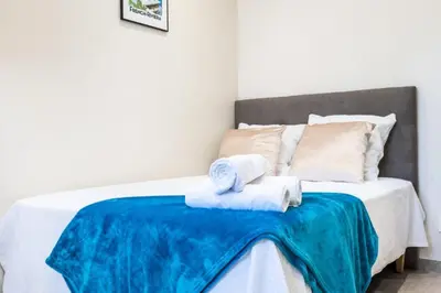 a bedroom with a bed with towels on it at Résidence Rare ! Rez-de-jardin 10 Minutes à Pied Du Centre - RARE ! Rez-de-jardin 10 minutes à pied du centre MAE-2413 in Cannes