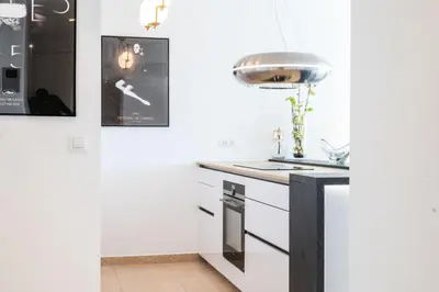 a kitchen with a sink and a stove top oven at Résidence 3p De Standing, Piscine, Vue Mer, à 2 Pas Des Plages - 3P de standing, piscine, vue mer, à 2 pas des plages MAE-2423 in Cannes