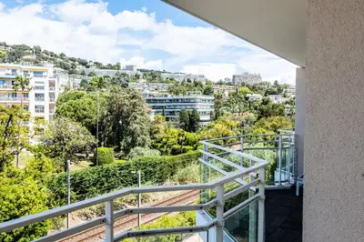 a balcony with a view of a city at Résidence 3p De Standing, Piscine, Vue Mer, à 2 Pas Des Plages - 3P de standing, piscine, vue mer, à 2 pas des plages MAE-2423 in Cannes