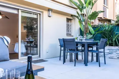 a dining table and chairs on a patio at Résidence Rare ! Studio Avec Terrasse à 5 Min à Pied Du Palais - Rare ! Studio avec terrasse à 5 min à pied du Palais MAE-2433 in Cannes