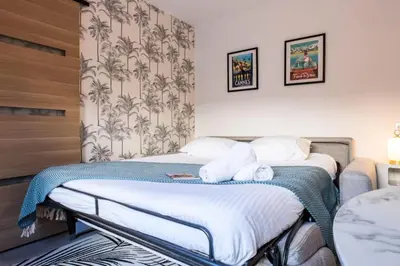 a hotel room with two beds in a room at Résidence Rare ! Studio Avec Terrasse à 5 Min à Pied Du Palais - Rare ! Studio avec terrasse à 5 min à pied du Palais MAE-2433 in Cannes