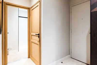 a bedroom with a door and a mirror at Résidence 3p Centre-ville Avec Jardin, 1min De La Croisette - 3P centre-ville avec jardin, 1min de la Croisette MAE-2443 in Cannes