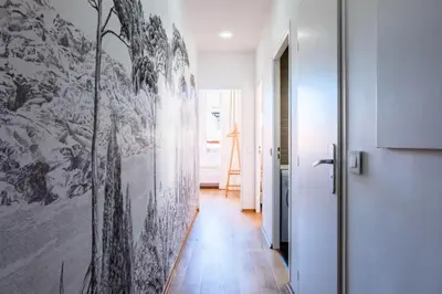 a hallway with a black and white painting on the wall at Résidence 3p Haut-de-gamme à 200m Des Plages Croisette - 3p haut-de-gamme à 200m des plages Croisette MAE-2453 in Cannes