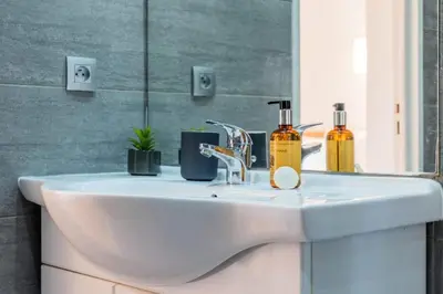a bathroom sink with two soap bottles on it at Résidence 3p Haut-de-gamme à 200m Des Plages Croisette - 3p haut-de-gamme à 200m des plages Croisette MAE-2453 in Cannes