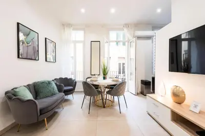 a living room with a couch and a table at Résidence Appartement Moderne En Plein Centre Ville ! - Appartement moderne en plein centre ville ! MAE-2463 in Cannes