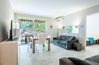 a living room with a couch and a table at Résidence 2p Avec Terrasse, Vue Mer Et Parking - 2P avec terrasse, vue mer et parking MAE-2483 in Cannes