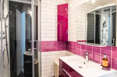 a pink bathroom with a sink and a shower at Résidence 2p Avec Terrasse, Vue Mer Et Parking - 2P avec terrasse, vue mer et parking MAE-2483 in Cannes