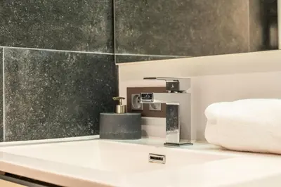 a bathroom with a sink and a faucet at Résidence 3p Lumineux Avec Terrasse à 15min à Pied Du Palais - 3P lumineux avec terrasse à 15min à pied du Palais MAE-2493 in Cannes
