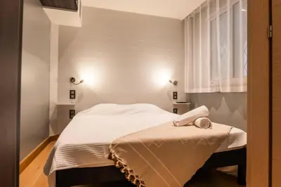 a small bed in a room with a window at Résidence 3p Lumineux Avec Terrasse à 15min à Pied Du Palais - 3P lumineux avec terrasse à 15min à pied du Palais MAE-2493 in Cannes