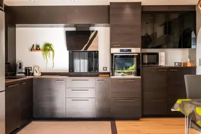 a large kitchen with stainless steel cabinets and appliances at Résidence 3p Lumineux Avec Terrasse à 15min à Pied Du Palais - 3P lumineux avec terrasse à 15min à pied du Palais MAE-2493 in Cannes