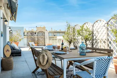 a patio with a table and chairs on a balcony at Résidence 3p Rooftop Palm Beach, Plages à 2min à Pied - 3P Rooftop Palm Beach, plages à 2min à pied MAE-2503 in Cannes
