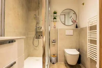 a bathroom with a shower and a toilet and a mirror at Résidence 3p Haut-de-gamme à 300m Des Plages Croisette - 3p haut-de-gamme à 300m des plages Croisette MAE-2563 in Cannes