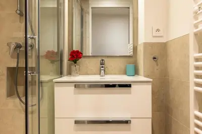 a white bathroom with a sink and a shower at Résidence 3p Haut-de-gamme à 300m Des Plages Croisette - 3p haut-de-gamme à 300m des plages Croisette MAE-2563 in Cannes