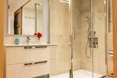 a bathroom with a shower and a sink and a mirror at Résidence 3p Haut-de-gamme à 300m Des Plages Croisette - 3p haut-de-gamme à 300m des plages Croisette MAE-2563 in Cannes