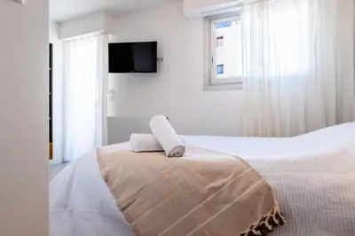 a bedroom with a bed with two towels on it at Résidence 4 Pièces Vue Mer, Terrasse Et Parking - 4 pièces vue mer, terrasse et parking MAE-2573 in Cannes