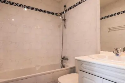 a bathroom with a tub and a toilet and a sink at Résidence 4p Avec Terrasse Vue Mer à Deux Pas Des Plages - 4P avec terrasse vue mer à deux pas des plages MAE-2593 in Cannes