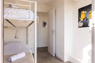 a bedroom with a bunk bed and a hallway at Résidence 4p Avec Terrasse Vue Mer à Deux Pas Des Plages - 4P avec terrasse vue mer à deux pas des plages MAE-2593 in Cannes