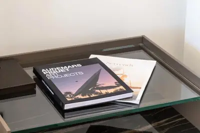 two books sitting on top of a glass table at Résidence Rare ! Appartement Grand Standing - Croisette - RARE ! Appartement grand standing - Croisette MAE-2603 in Cannes