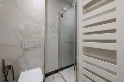 a bathroom with a glass shower and a toilet at Résidence Rare ! Appartement Grand Standing - Croisette - RARE ! Appartement grand standing - Croisette MAE-2603 in Cannes