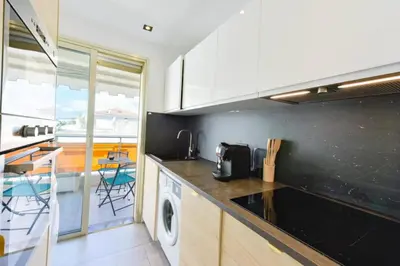 a kitchen with a washer and dryer on the counter at Résidence 2p Rénové, Terrasse Et Plage à Pied - 2P rénové, terrasse et plage à pied MAE-2623 in Cannes