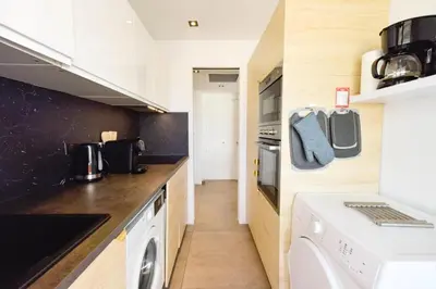 a kitchen with a washer and dryer at Résidence 2p Rénové, Terrasse Et Plage à Pied - 2P rénové, terrasse et plage à pied MAE-2623 in Cannes