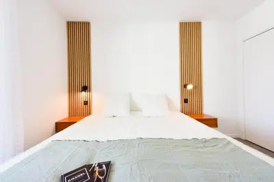 a bed with white sheets and pillows in a room at Résidence 2p Rénové, Terrasse Et Plage à Pied - 2P rénové, terrasse et plage à pied MAE-2623 in Cannes