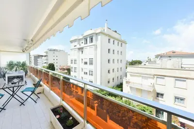 a balcony with a view of a building at Résidence 2p Rénové, Terrasse Et Plage à Pied - 2P rénové, terrasse et plage à pied MAE-2623 in Cannes