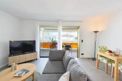 a living room with a couch and a table at Résidence 2p Rénové, Terrasse Et Plage à Pied - 2P rénové, terrasse et plage à pied MAE-2623 in Cannes