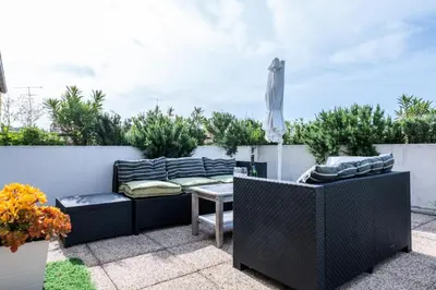 a patio with a couch and a table at Résidence Rare ! Rooftop 120m² 5min à Pied Du Centre - RARE ! ROOFTOP 120m² 5min à pied du centre MAE-2643 in Cannes