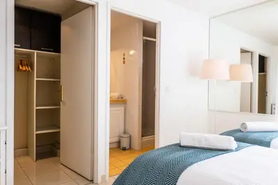 a bedroom with a bed and a bathroom at Résidence Rare ! Rooftop 120m² 5min à Pied Du Centre - RARE ! ROOFTOP 120m² 5min à pied du centre MAE-2643 in Cannes