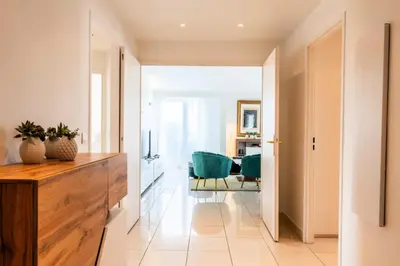 a hallway with a desk and green chairs at Résidence Rare ! Rooftop 120m² 5min à Pied Du Centre - RARE ! ROOFTOP 120m² 5min à pied du centre MAE-2643 in Cannes