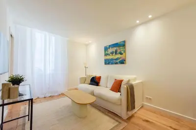 a living room with a couch and a table at Résidence 2p De Standing à 100m Du Palais - 2p de standing à 100m du Palais MAE-2683 in Cannes