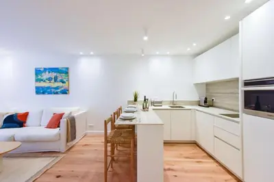 a kitchen and living room with a couch and a table at Résidence 2p De Standing à 100m Du Palais - 2p de standing à 100m du Palais MAE-2683 in Cannes