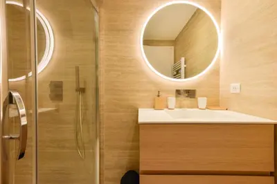 a bathroom with a sink and a mirror at Résidence 2p De Standing à 100m Du Palais - 2p de standing à 100m du Palais MAE-2683 in Cannes