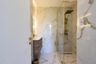 a bathroom with a shower with a glass door at Résidence Rare 4p Standing Proche Croisette - Rare 4P standing proche Croisette MAE-2713 in Cannes