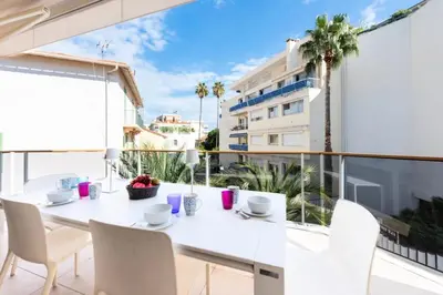 a white dining room with a white table and chairs at Résidence 3p Piscine, Parking Et Plages à 100m - 3P piscine, parking et plages à 100m MAE-2763 in Cannes