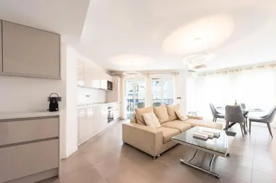 a living room with a couch and a table at Résidence 3p Piscine, Parking Et Plages à 100m - 3P piscine, parking et plages à 100m MAE-2763 in Cannes