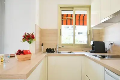 a kitchen with a sink and a bowl of fruit on the counter at Résidence Palm Beach Studio Avec Terrasse A 150m Des Plages - Palm Beach studio avec terrasse a 150m des plages MAE-2773 in Cannes