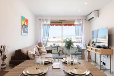 a living room with a couch and a table at Résidence 2p Rénové Proche Croisette - 2P Rénové proche Croisette MAE-2783 in Cannes