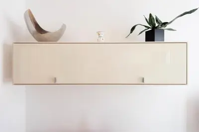 a white shelf with a plant and a vase on it at Résidence Cannes 2p Carré D’or - Cannes 2p Carré d’Or MAE-2793 in Cannes