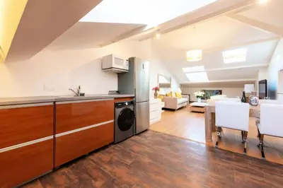 a kitchen and living room with a washer and dryer at Résidence Beau 2 Pièces à 3 Min De La Croisette - Beau 2 Pièces à 3 min de la Croisette MAE-2803 in Cannes