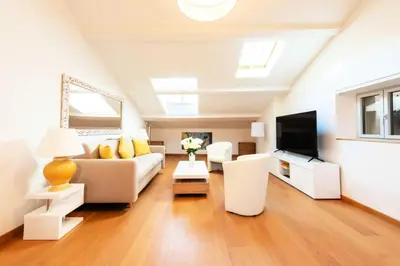 a living room with a couch and a tv at Résidence Beau 2 Pièces à 3 Min De La Croisette - Beau 2 Pièces à 3 min de la Croisette MAE-2803 in Cannes