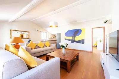 a living room with a couch and a table at Résidence Superbe 3 Pièces à 3 Min De La Croisette - Superbe 3 Pièces à 3 min de la Croisette MAE-2813 in Cannes