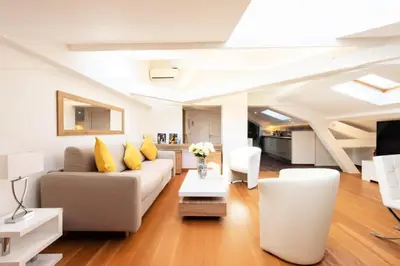 a living room with a couch and a table at Résidence Grand Studio à 3 Min De La Croisette - Grand Studio à 3 min de la Croisette MAE-2823 in Cannes